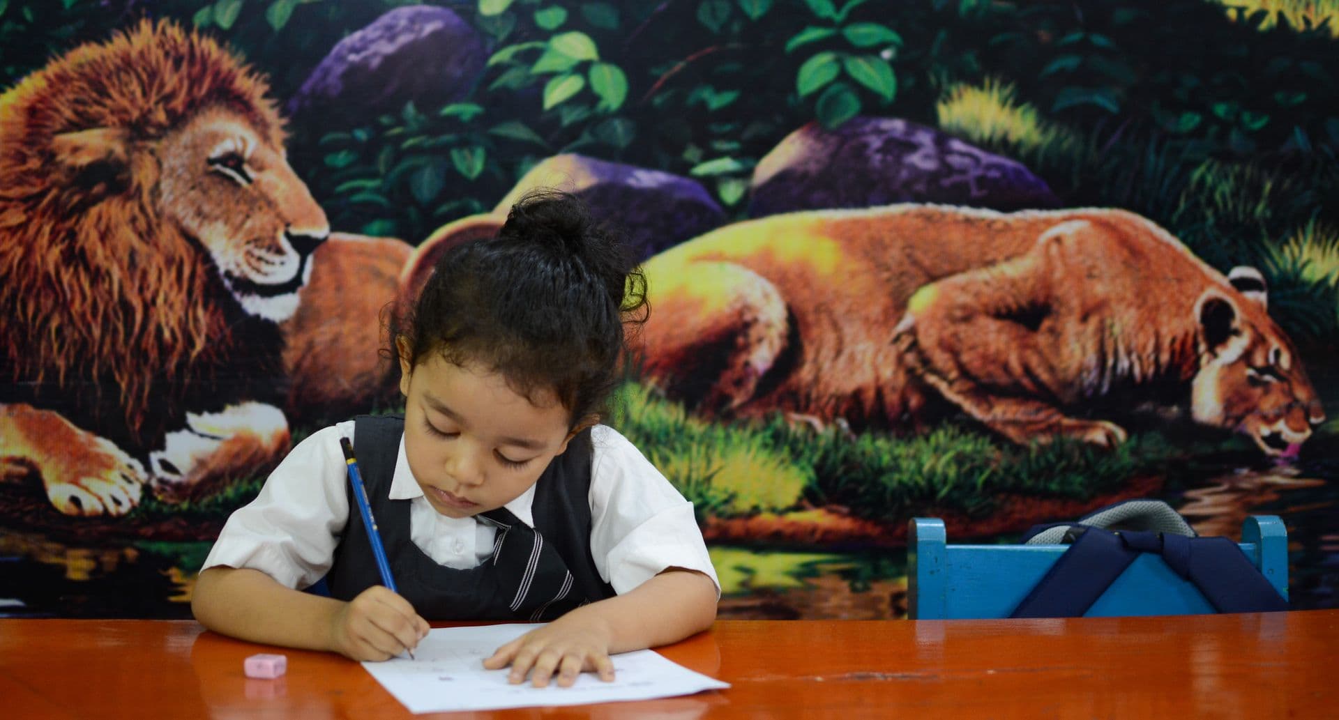 Students actively participating in a music class, playing various instruments